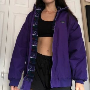 Purple puffy jacket with cool design inside.